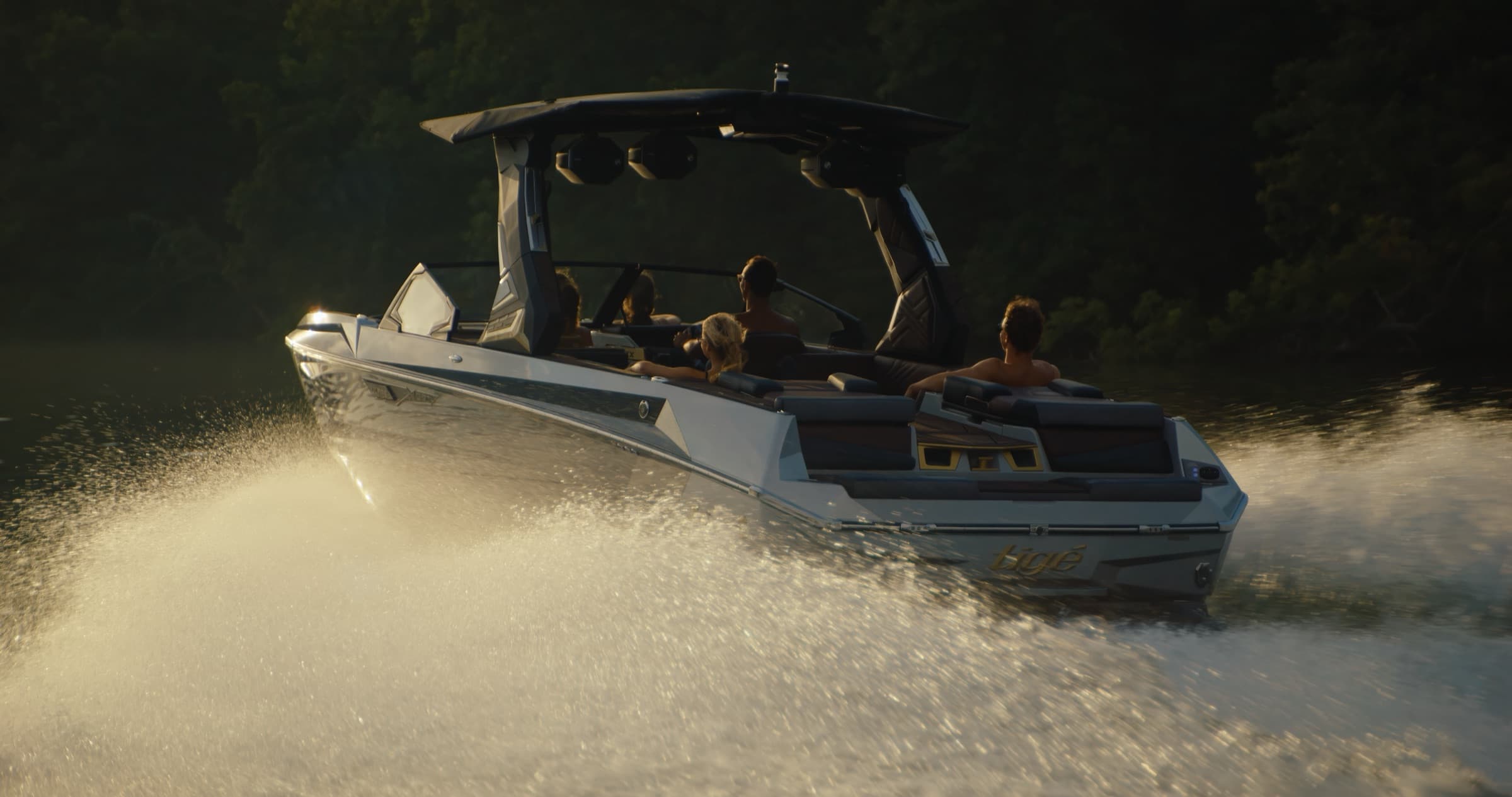 Tige boat on Lake Austin at golden hour