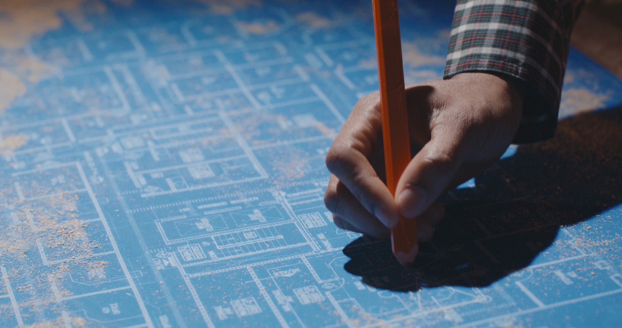 Hand drawing on architectural blueprints