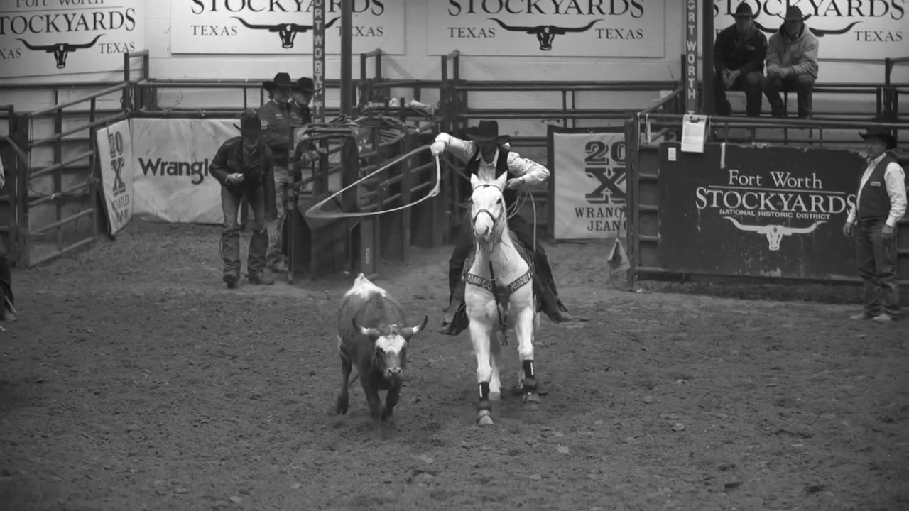 A roper on horseback in the arena at the Fort Worth Stockyards