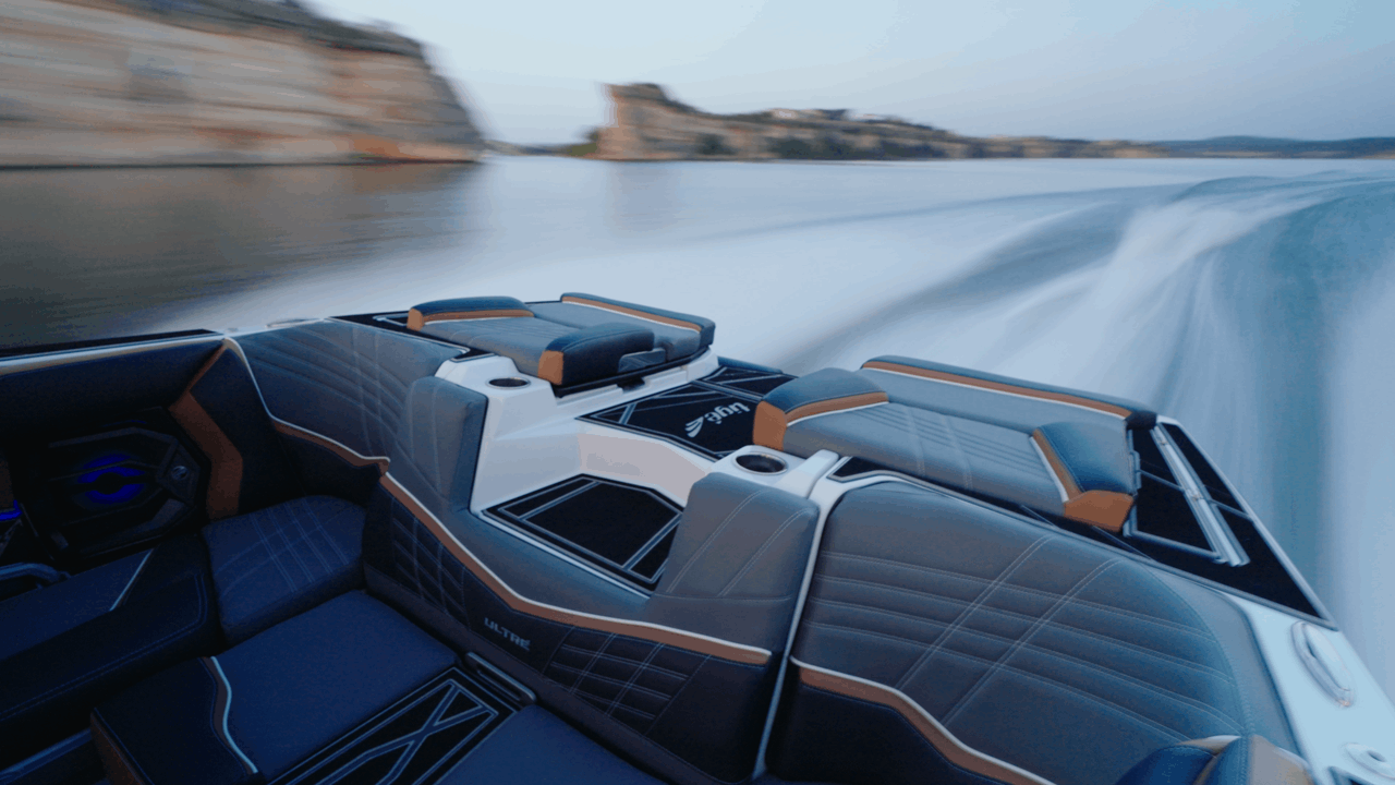 Rear angle slow-motion shot of Tige boat wake