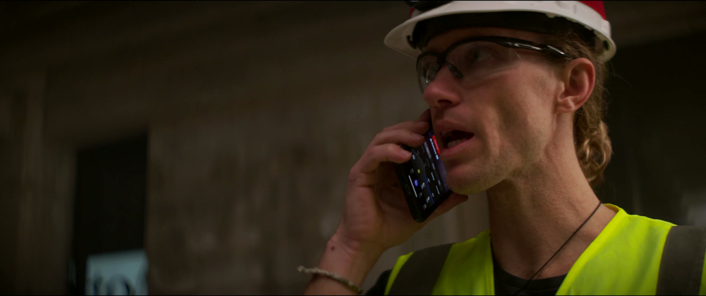Still frame titled "Construction Worker Radio Closeup" from the Filmsupply Factory Bike TV Construction Selects source drop.