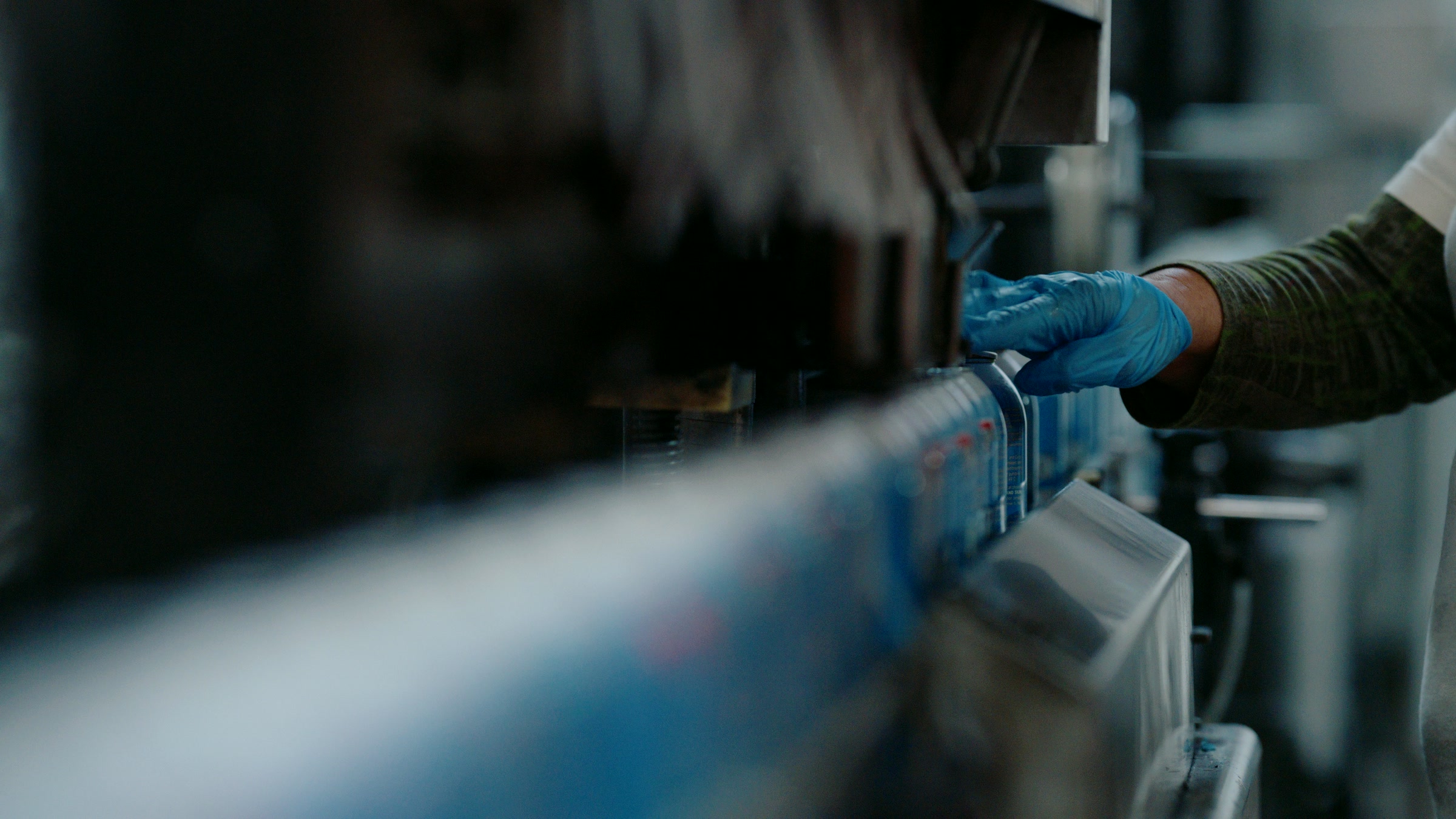 Still frame titled "Factory Gloved Line Inspection" from the Filmsupply Factory Bike TV Construction Selects source drop.