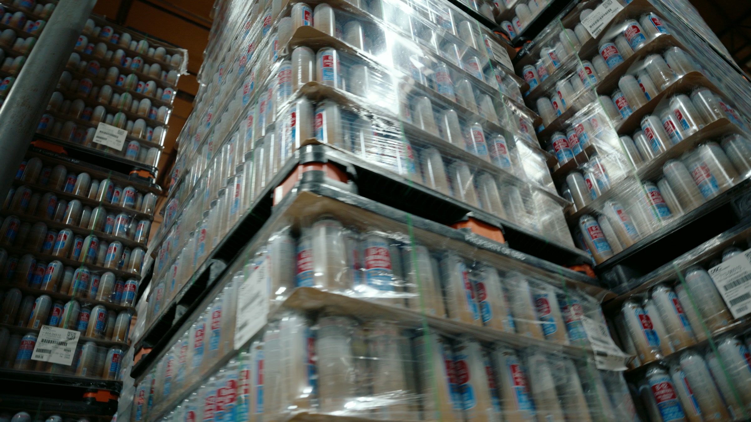 Still frame titled "Factory Pallet Tower Aisle" from the Filmsupply Factory Bike TV Construction Selects source drop.