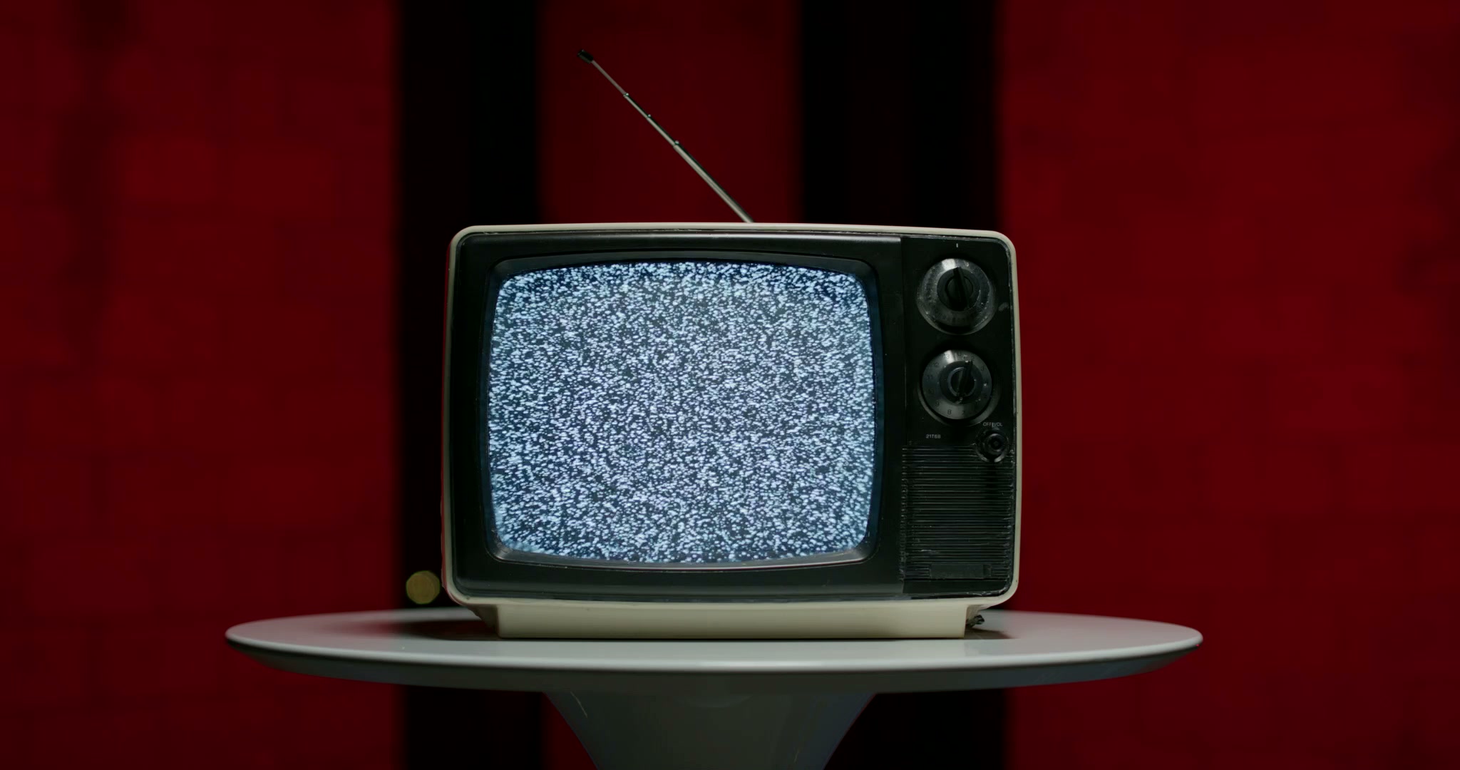 Still frame titled "TV Static Red Room Wide" from the Filmsupply Factory Bike TV Construction Selects source drop.