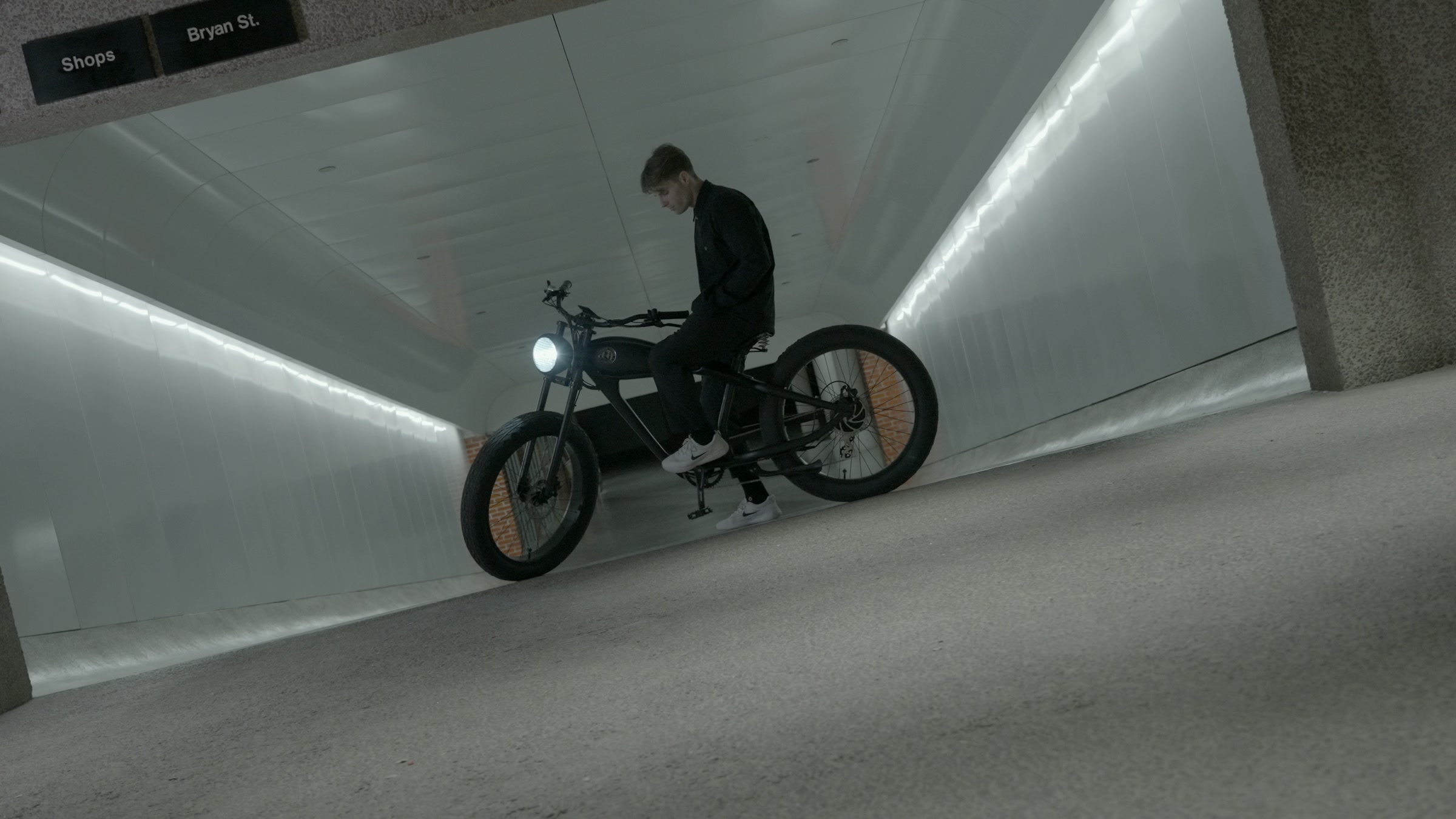 Still frame titled "White Corridor Bike Rollout" from the Filmsupply Factory Bike TV Construction Selects source drop.