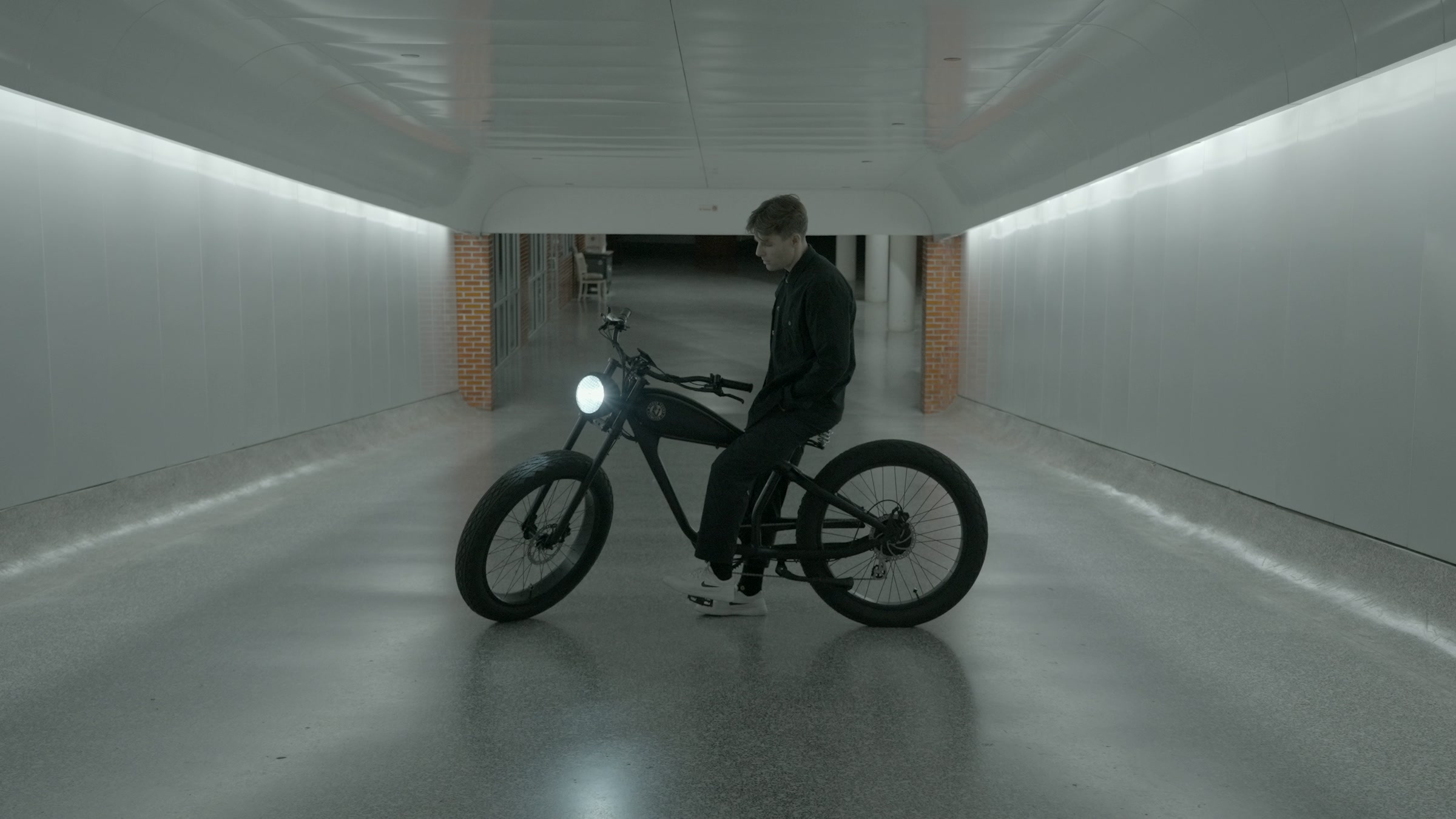 Still frame titled "White Corridor E-Bike Profile" from the Filmsupply Factory Bike TV Construction Selects source drop.