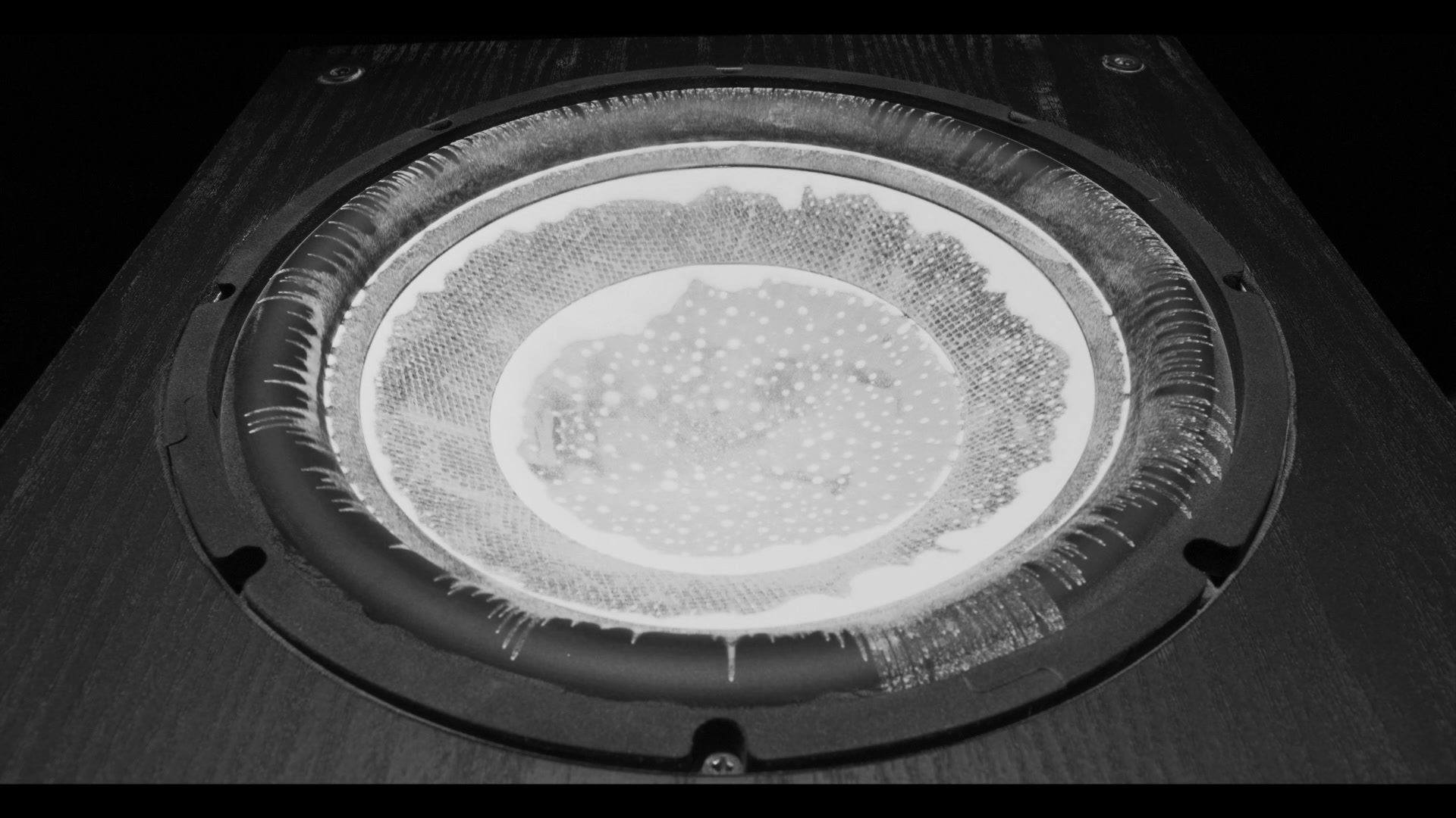 Still frame titled "Powder Stringout Opening Texture" from the GLM Filmsupply Frame Grab Titles source drop.