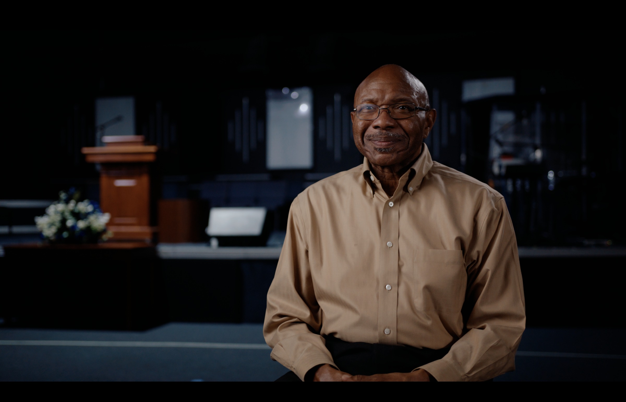 Still frame titled "Church Stage Interview" from the GLM Filmsupply Frame Grab Titles source drop.
