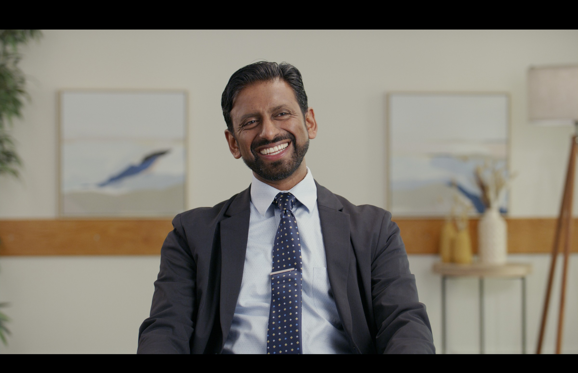 Still frame titled "Executive Office Smile Interview" from the GLM Filmsupply Frame Grab Titles source drop.