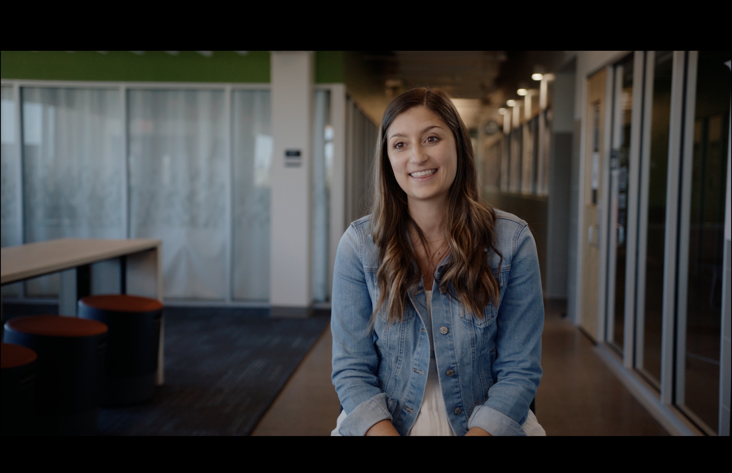 Still frame titled "High Ground Office Woman Interview" from the GLM Filmsupply Frame Grab Titles source drop.