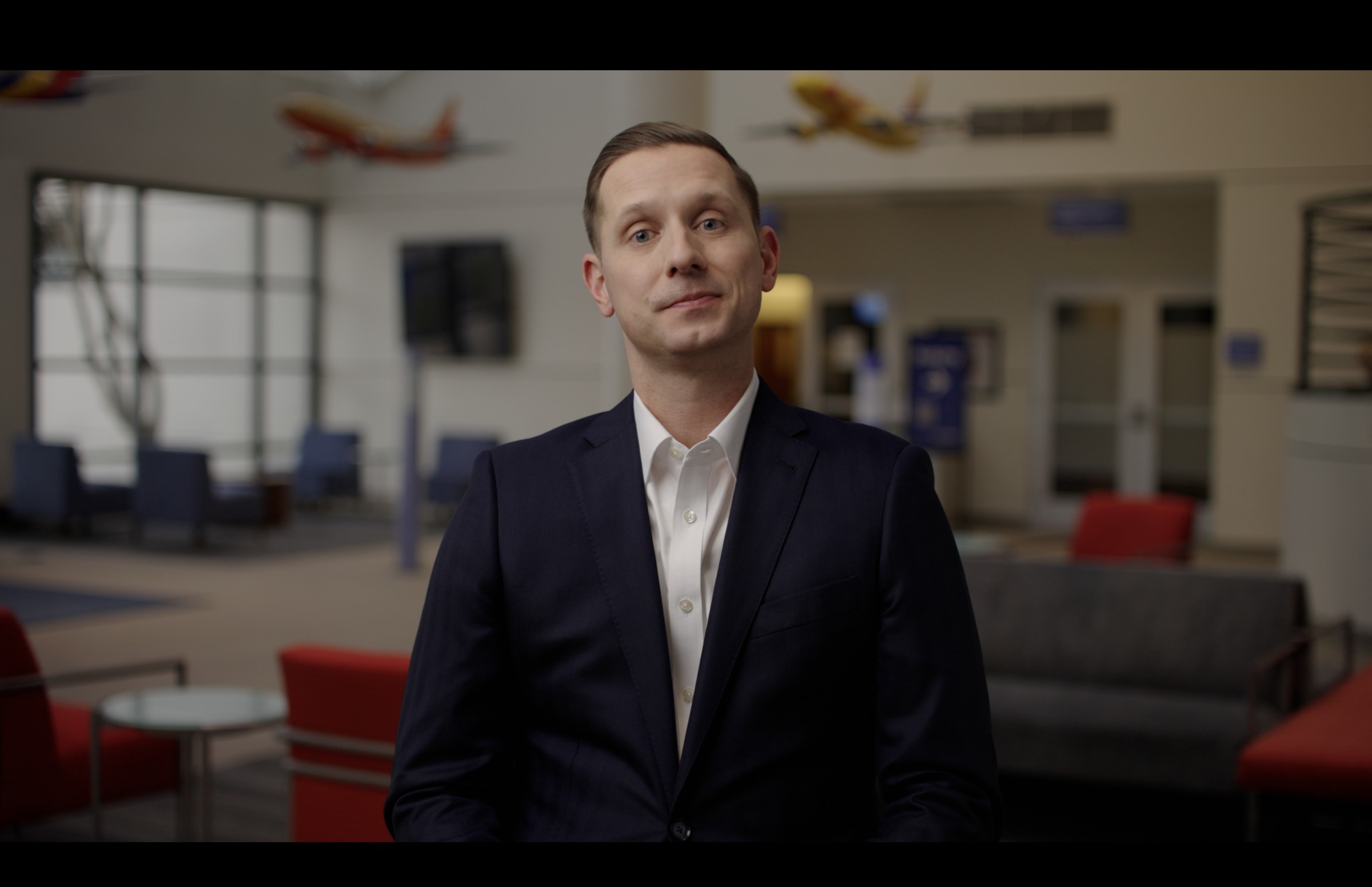 Still frame titled "Kindness Interview Neutral" from the GLM Filmsupply Frame Grab Titles source drop.