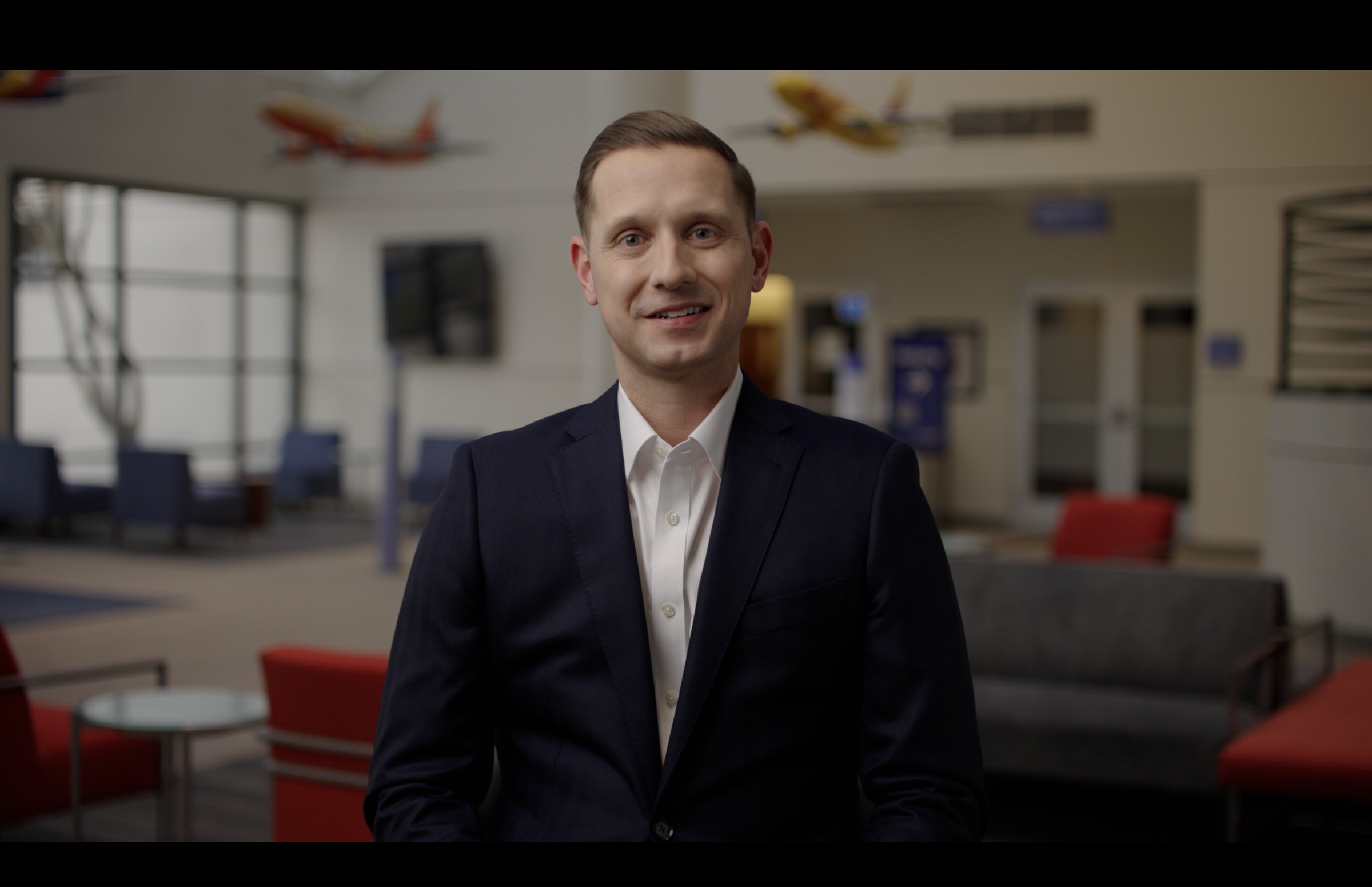 Still frame titled "Kindness Interview Smile" from the GLM Filmsupply Frame Grab Titles source drop.
