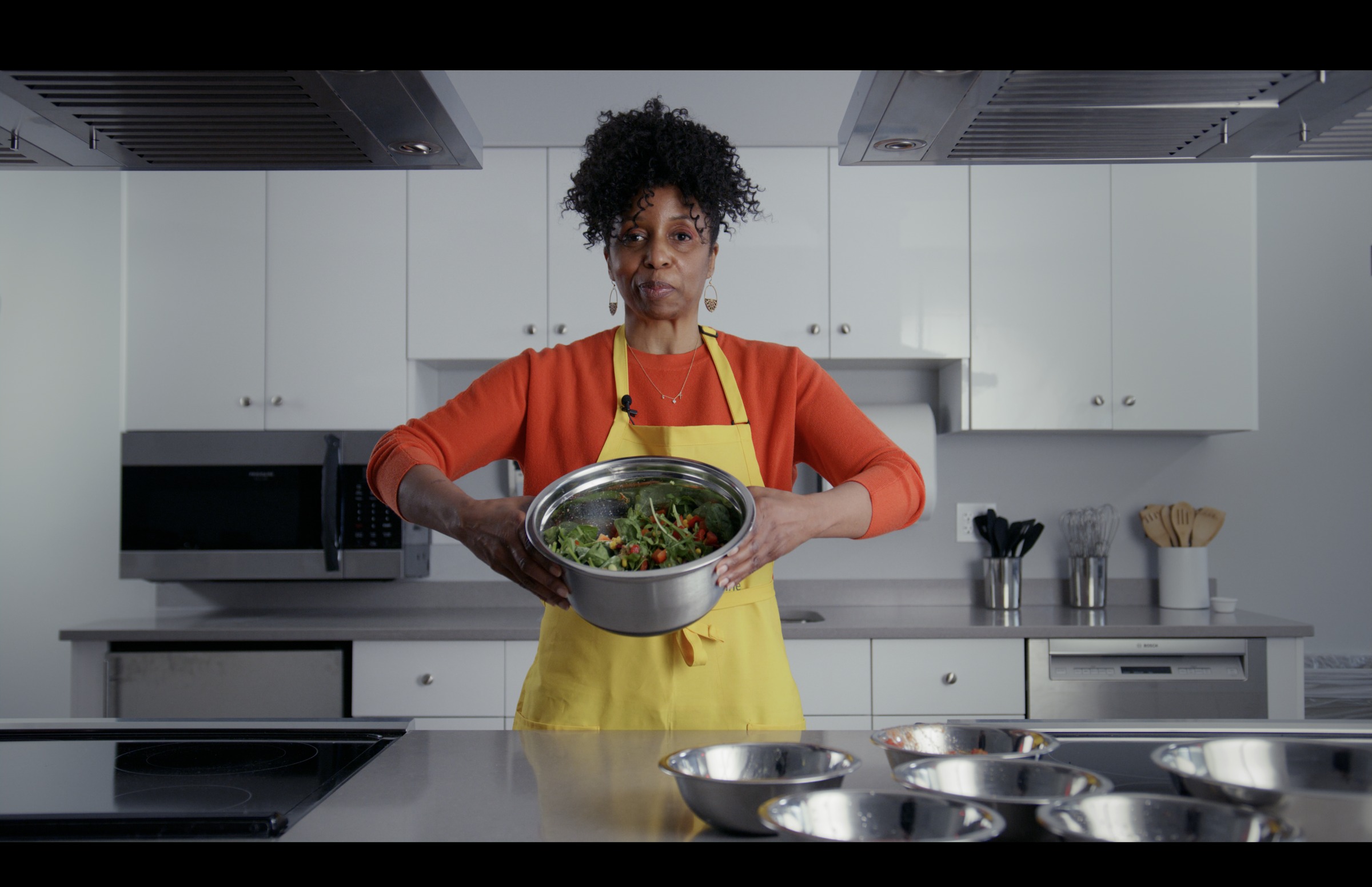 Still frame titled "Kitchen Chef Demo" from the GLM Filmsupply Frame Grab Titles source drop.