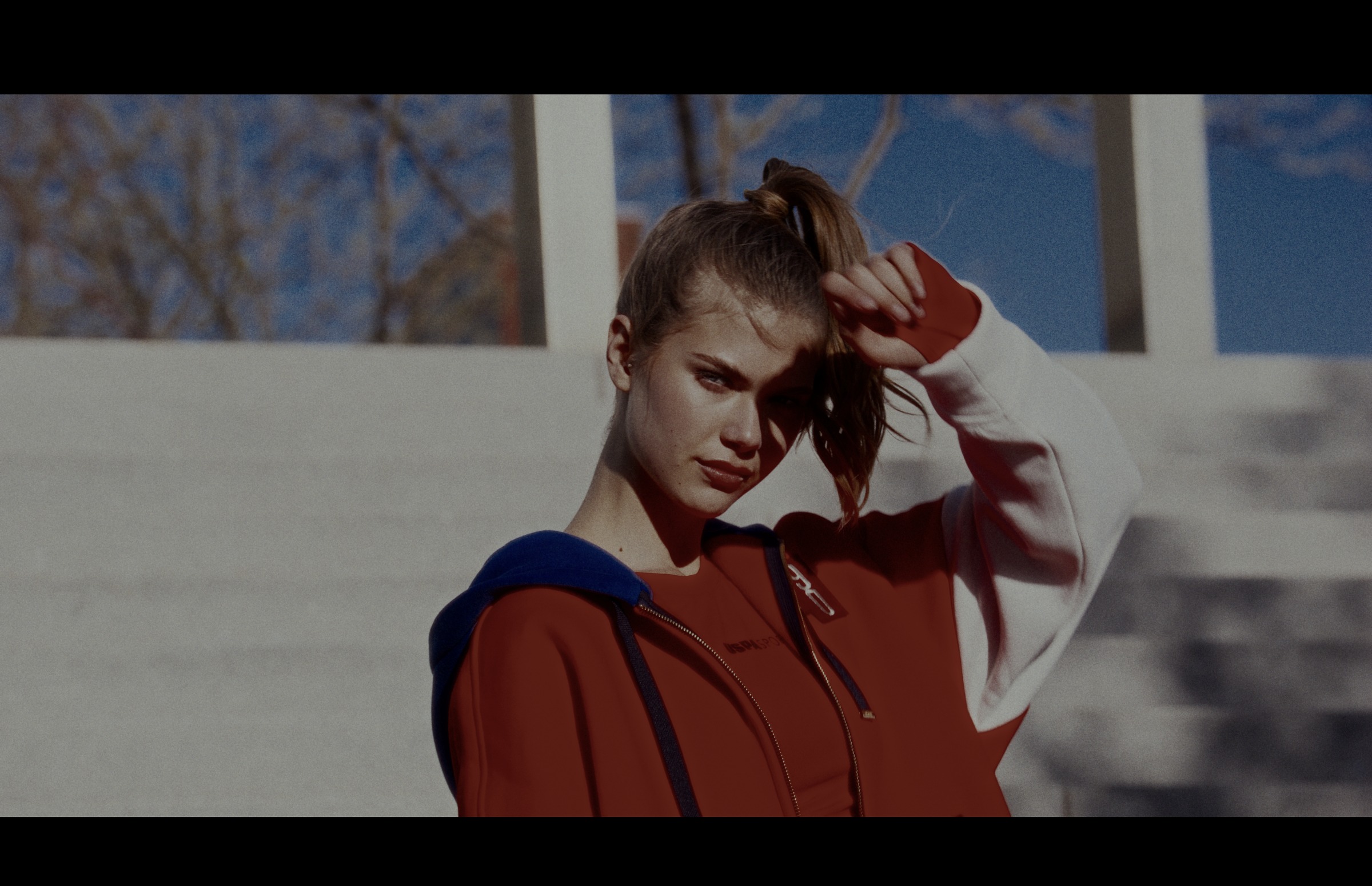 Still frame titled "Red Sportswear Stair Portrait" from the GLM Filmsupply Frame Grab Titles source drop.
