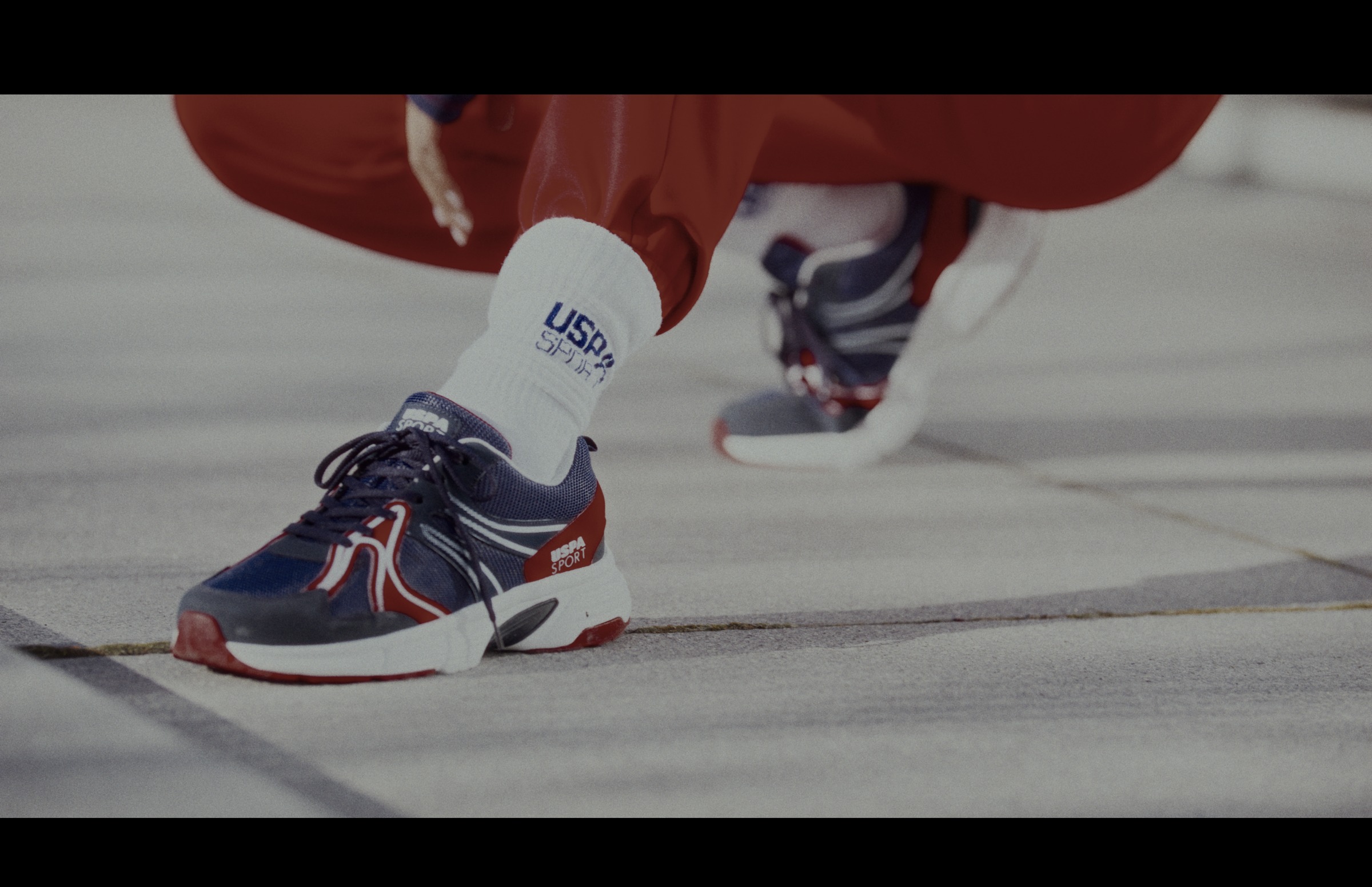 Still frame titled "Sneaker Detail Cutaway" from the GLM Filmsupply Frame Grab Titles source drop.