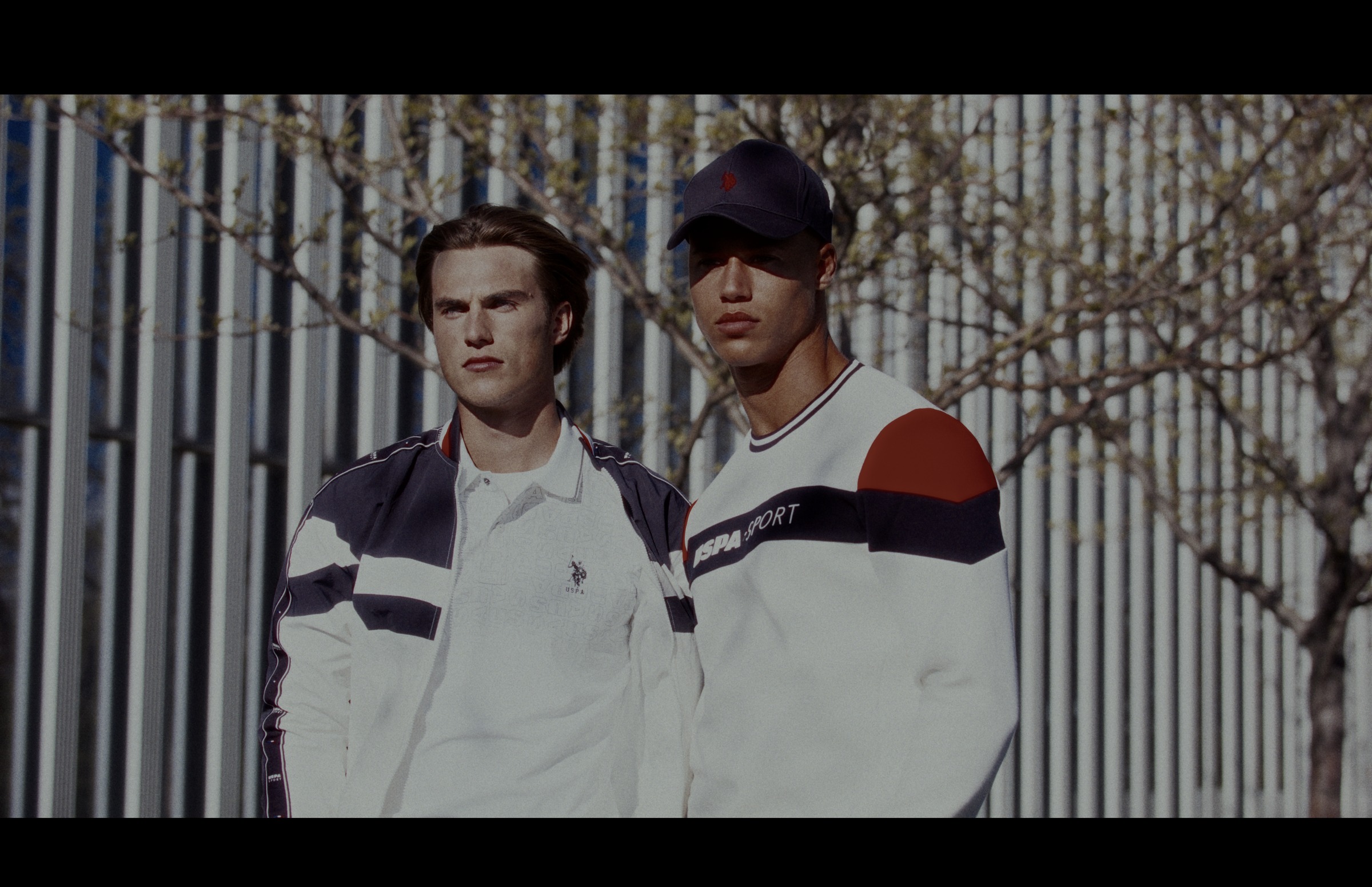 Still frame titled "Sportswear Fence Duo" from the GLM Filmsupply Frame Grab Titles source drop.